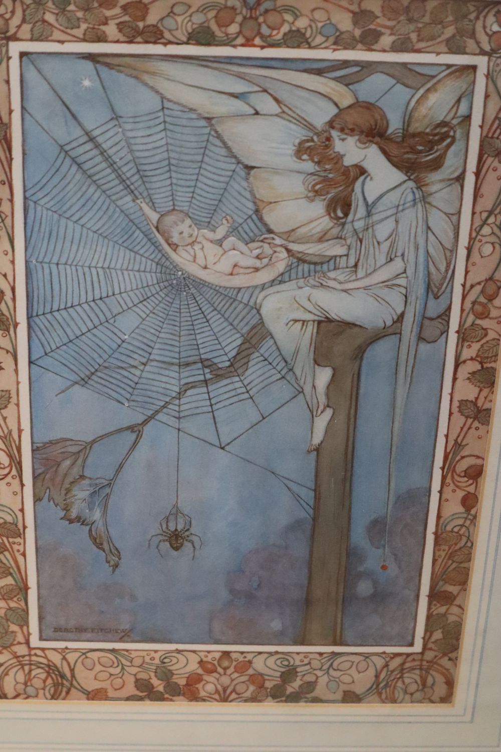 Dorothy Fitchew (19th/20th century), watercolour, fairy with baby cradled in a spiders web, decorative boder, signed, 28 x 18cm